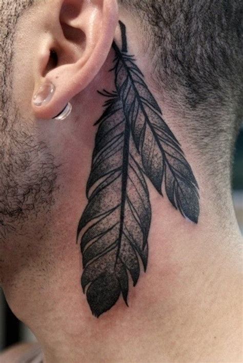 Behind the ear tattoos can add a fun update to your look. . Feather tattoos behind the ear